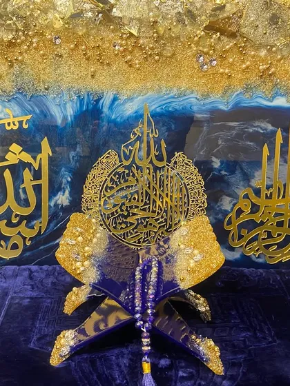 This shows how I can create a complete, coordinated look for a room. The set includes a large wall art piece with Ayat ul Kursi, Mashallah, and Bismillah calligraphy, alongside a matching Quran holder, all in a striking royal blue and gold theme.