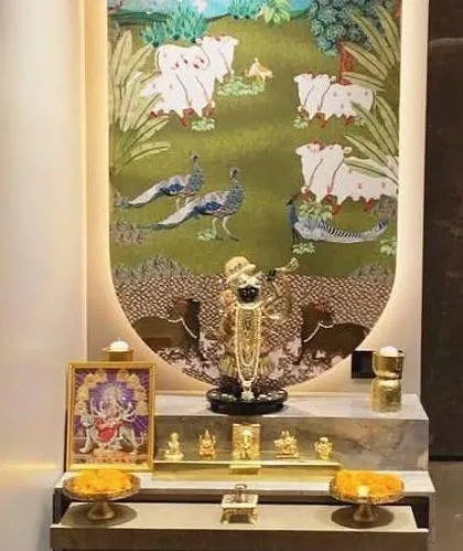 This sacred corner is dedicated to Shrinathji, featuring a stunning Pichwai art piece as the backdrop. I designed the multi-level platform in a clean, modern finish to beautifully contrast with the rich, traditional artwork. This setup shows how we can build a custom mandir space around a specific deity and art style that is special to you and your family.