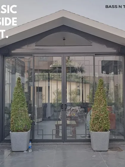 This entertainment den and terrace setup features a seamless multi-room AV system. We installed Monitor Audio all-weather speakers outside and Bronze series towers inside, allowing the client to play music in one zone or sync them for a party that flows from the inside out.