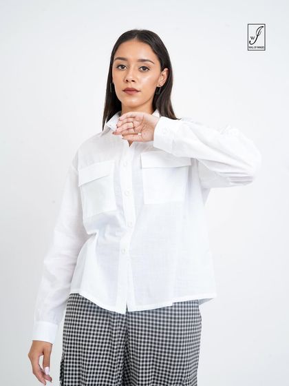 A closer shot focusing on the top half of the outfit, highlighting the pocket details on the white shirt.