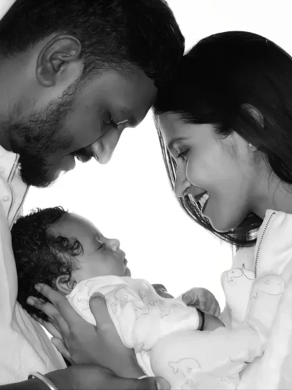A quiet moment with your newborn is priceless. I use black and white photography to capture the deep, emotional connection between parents and their new baby, creating a timeless family heirloom.
