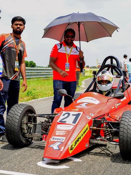 A pre-race moment on the grid, where our team ensures both the driver and the Formula LGB car are perfectly prepared for the competition ahead.