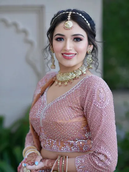A smiling portrait of this neutral makeup look. It's a timeless and sophisticated style that is perfect for any formal event.