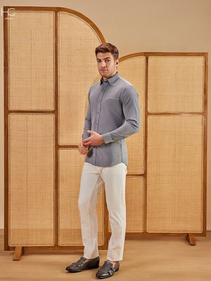 Corduroy, but make it effortless. This grey corduroy shirt features subtle stitching and a rich texture, creating a style that just flows. It's perfect for your next weekend brunch.