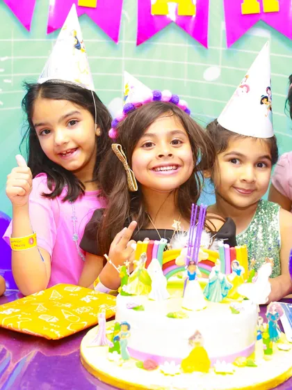 All smiles at a princess-themed birthday party. We provide party hats and a festive atmosphere for all the kids to enjoy.