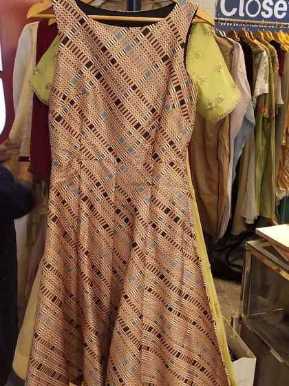 A unique printed gown with a diagonal pattern and cold-shoulder cutouts. This is one of the many one-of-a-kind sample pieces you can discover in our store.