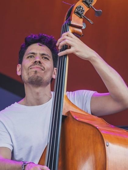 A close-up of our bassist during the Jetlag Music Festival performance. His solid grooves are the foundation of our sound, bridging jazz and Indian rhythms.