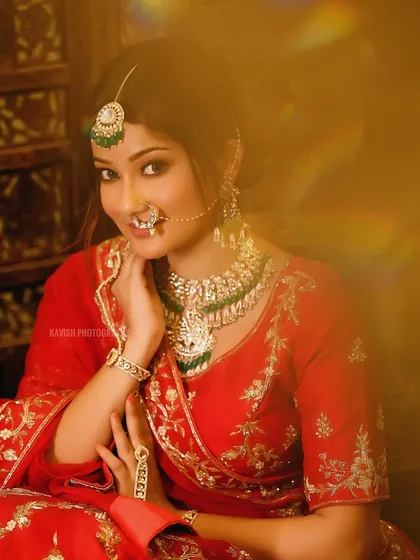 A beautiful smile captured with the same artistic light flare, creating a soft and romantic bridal photo.