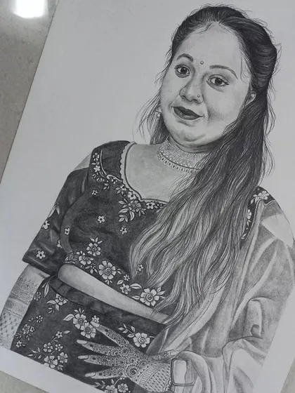 An angled shot of the finished A3 portrait, giving a better sense of the drawing's scale and presence on the paper.