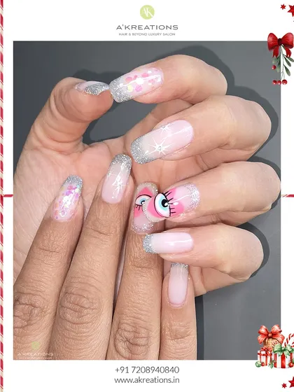 This angle showcases the combination of glitter, sheer pink, and the bold eye artwork. It's a great example of how I can mix different styles into one cohesive set.
