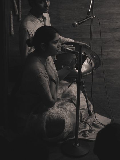 Live musicians playing the handpan and other instruments during "Samvit." We often collaborate with talented musicians to create a complete sensory experience in our productions.