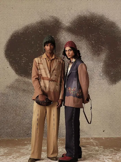 A shot from the "Vinyl Echoes" menswear campaign for Cord. The custom-painted, textured backdrop was created to evoke a sense of history and renewal, matching the collection's theme.