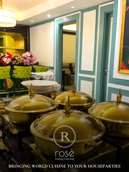 We bring world cuisine to your house parties. This image shows a beautiful buffet setup in a residential setting, demonstrating our ability to transform any space into a luxurious dining venue.