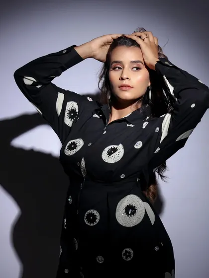 A more dynamic pose in the patterned shirt. This shot shows off the model's hair and adds a sense of movement to the portrait.
