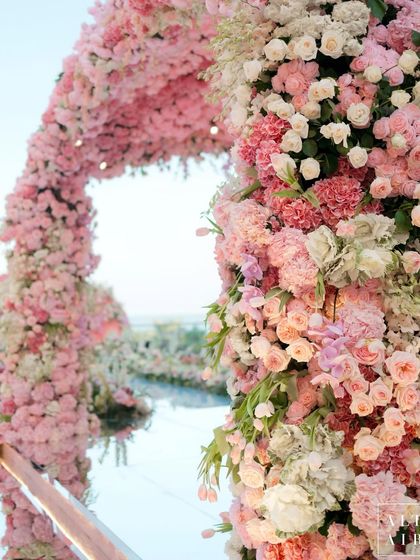 Detail of the lush, cascading flowers on the 'Echoes of Pink' mandap. The combination of different shades of pink and white created a soft, romantic, and utterly breathtaking structure.