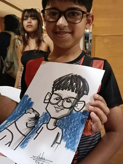 A young boy and his dog, both captured in this caricature from the OnePlus pet event.