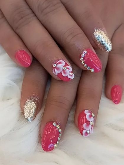 A full view of the pink, gold glitter, and 3D floral nail art combination.