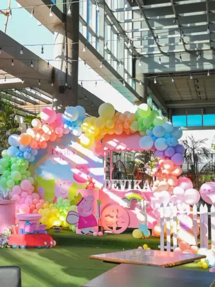 This duplicate shot of the Peppa Pig party shows the full setup from a distance, capturing the lively and colorful atmosphere.