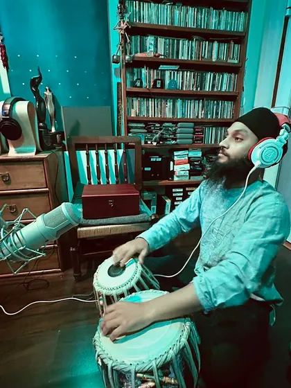 A side view of my recording posture. It is important to be comfortable yet alert to play with precision and stamina for long sessions.