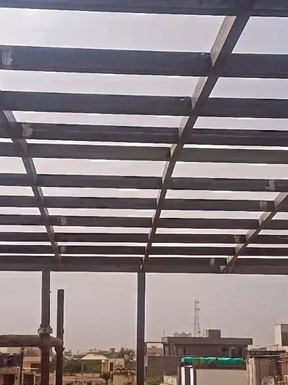 A view of the bare steel grid for a pergola roof before the final cladding or glass is installed. This skeleton shows the strong and precise foundation of our structures.