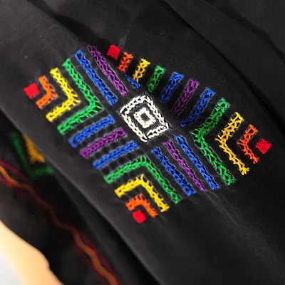A memory of a past creation, this piece features a vibrant, multi-colored geometric pattern typical of Lambani or Banjara embroidery.