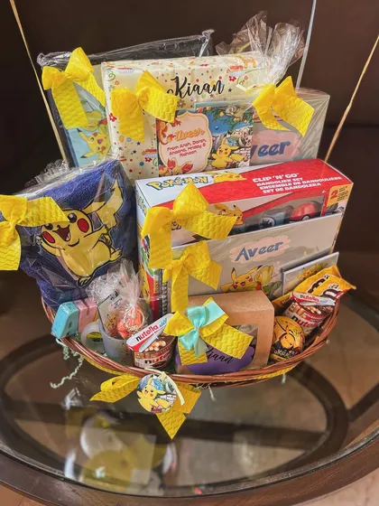 The full Pokémon hamper, showcasing a mix of toys, treats, and custom-made items for the birthday boy.