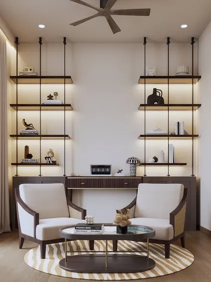 This view shows a dedicated study or home office nook with twin armchairs and backlit shelving, demonstrating a symmetrical and highly functional design.