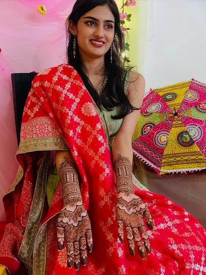 Seeing my clients happy is the best part of my work. Here is a beautiful bride-to-be, glowing during her mehendi ceremony, showcasing the full design that we created together for her special day.