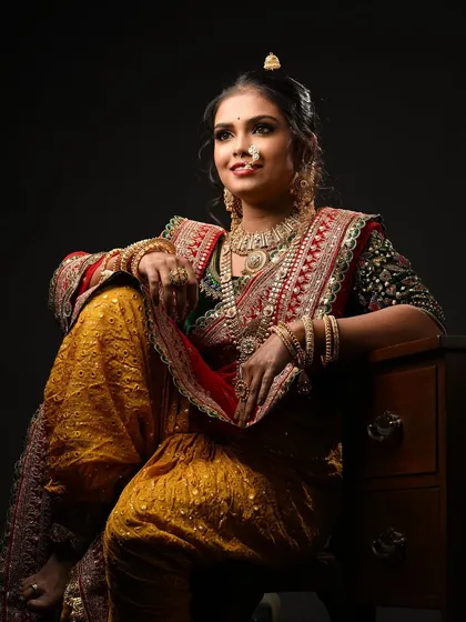 A full-length view showcasing the complete bridal attire. My students learn about the entire look, not just the face, to ensure their work is harmonious.
