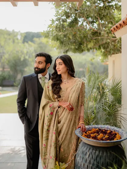 A portrait that feels natural and unposed. The couple stands together in the soft, natural light, creating a sense of shared dreams and looking towards the future together.