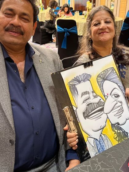 Another couple from the same event, with a caricature that captures their likeness in a fun, cartoonish way.