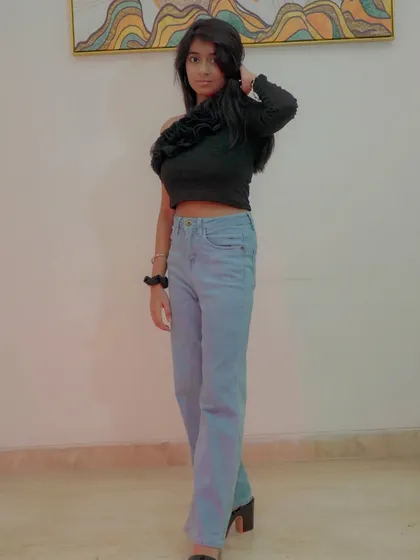 A full-length indoor shot showcasing a modern, casual fashion look. This type of photo is great for building a versatile modeling portfolio that includes western wear.