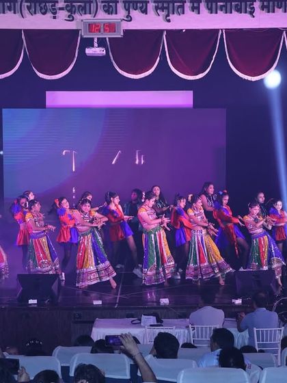 A wide shot of the "Tarulya" finale, showcasing the scale of our production. With dozens of dancers in colorful costumes, we create a visually stunning conclusion to our show.