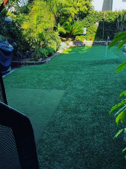 Even in a more compact backyard, I can install a functional putting green. This setup is perfect for daily practice and fits neatly into a fenced-in area.