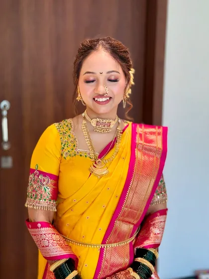 The bride's happy and serene expression says it all. The makeup is set to last through all the ceremonies and emotions of the day.
