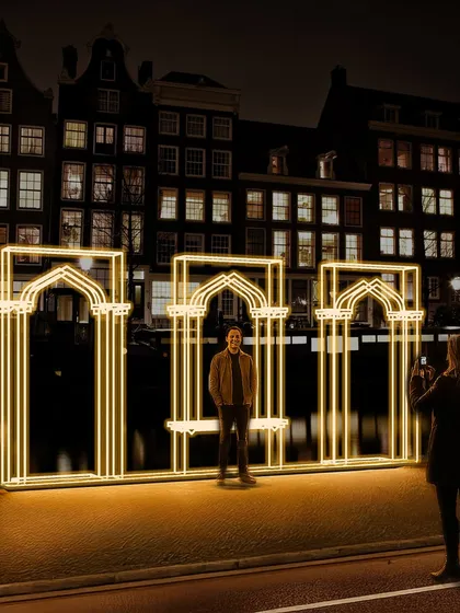 At street level, our 'Echoes of the Deep' installation becomes an interactive threshold. People can stand within the glowing archways, making them part of the artwork. This highlights our goal to create public art that is not just seen, but experienced.