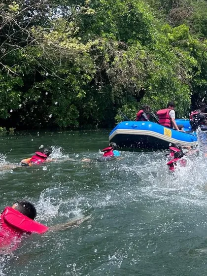 Participants enjoy a swim in the Kali River, a refreshing break during their action-packed day at the Dandeli camp.