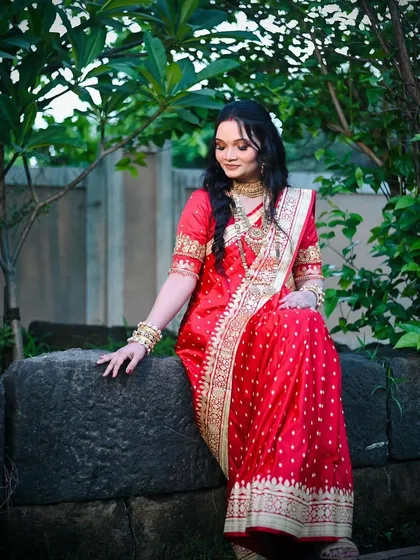 An outdoor shot of this new mom at her baby's naming ceremony. The makeup is soft and elegant, designed to look beautiful in natural light.