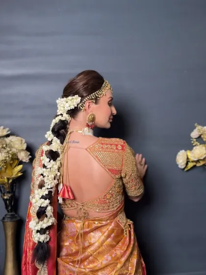 Another angle of the South Indian braid, showing the neatness of the sections and the secure placement of the matha patti. These details are key to creating a professional and long-lasting bridal hairstyle.