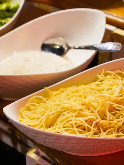 Fresh spaghetti and grated parmesan cheese, key ingredients for my live pasta station. I only use high-quality ingredients for the best taste.