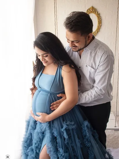 A close-up shot focusing on the baby bump. These intimate photos beautifully capture the anticipation and love of waiting for your baby.