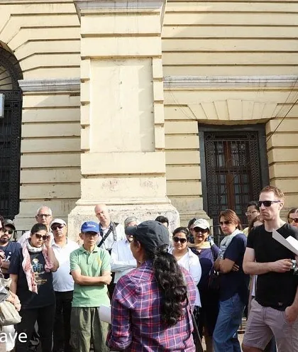 A close-up of a group on the Chandni Chowk walk. I use archival maps and texts to explain the layers of history contained within these colonial-era buildings.