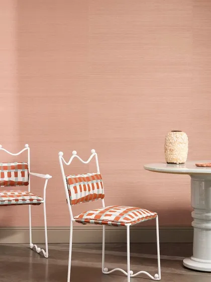 “Abaca” by Nobilis is a refined wallcovering crafted from handwoven plant fibers. Offered in 32 earthy tones, its subtle texture echoes the quiet elegance of nature, as seen here in a soft blush.