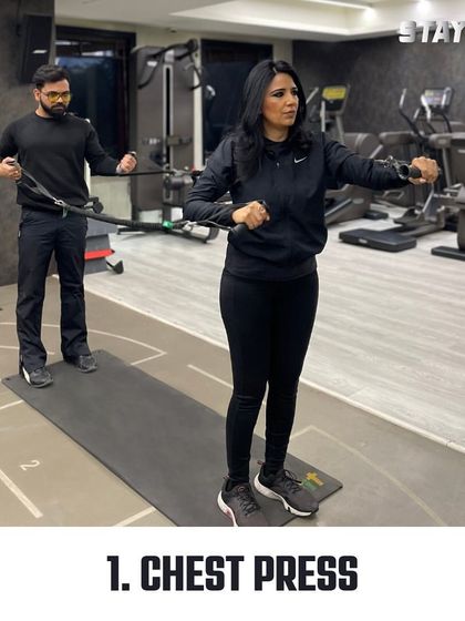 The partner chest press with a resistance band is an excellent way to work your upper body while staying perfectly in sync with your workout buddy.