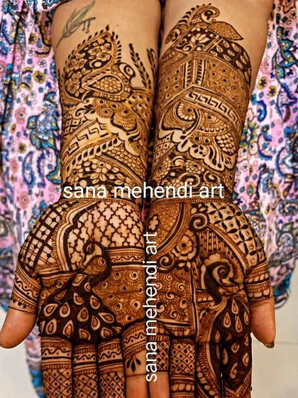 This Rakhi mehndi design is filled with graceful peacocks on the palms and arms. The combination of bird motifs and geometric patterns is a popular choice for festivals.