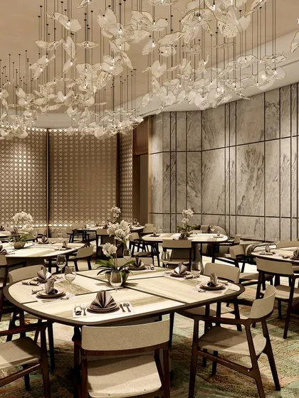 Another perspective of the Ceejay Residency banquet hall, showcasing the beautiful interplay of light and texture. The design uses curved walls and a soft color palette to create a warm and inviting atmosphere.