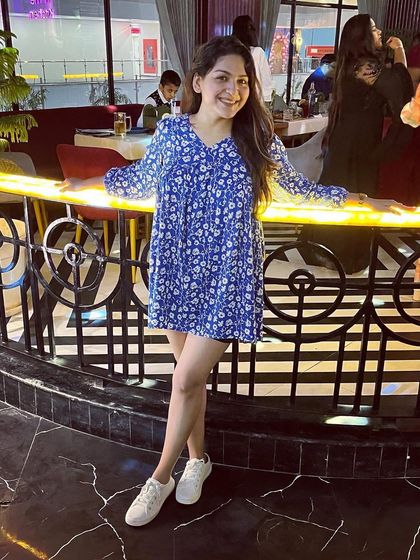 A throwback to a weekend outing at a pub in Noida. This simple blue and white floral dress paired with white sneakers is my go-to formula for a casual and chic look.