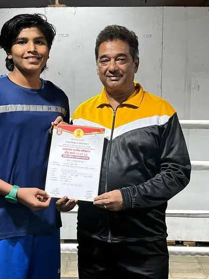 With Jagruti Both after she won the DSO Maharashtra School States Boxing Championships. This certificate is proof of her hard work and bright future.