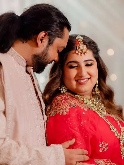 A collection of moments from this bride's reception. Her look was all about soft glam, with flowing waves and makeup that highlighted her joyful smile, creating a perfect look for her evening celebration.