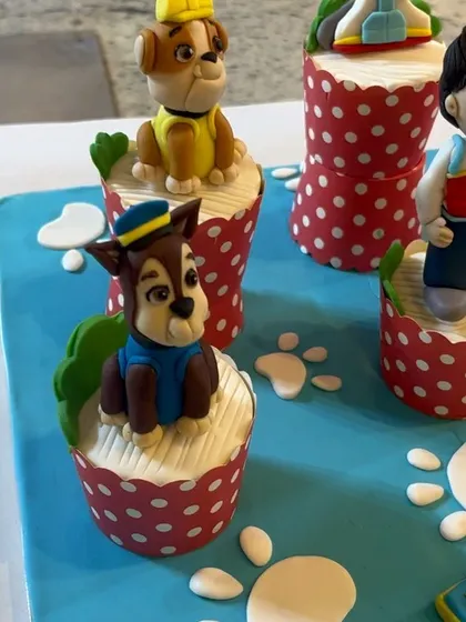 A close-up shot of the handcrafted Chase and Rubble fondant toppers. We spend hours, often late into the night, to make sure every detail on these edible character models is perfect.
